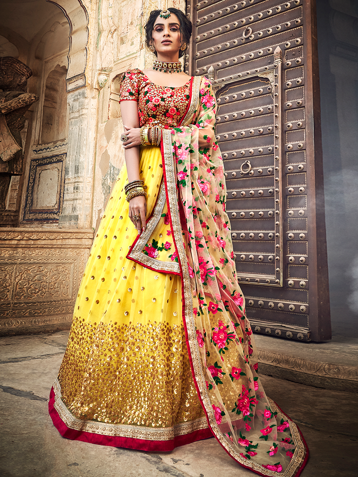 Odette Women Yellow Embroidered Soft Net Semi Stitched Lehenga With Unstitched Blouse