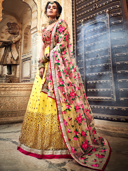 Odette Women Yellow Embroidered Soft Net Semi Stitched Lehenga With Unstitched Blouse
